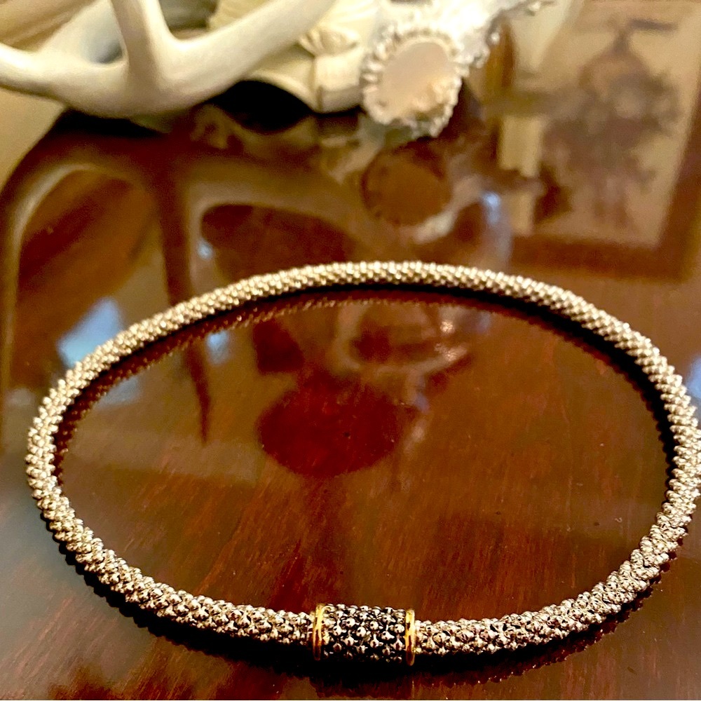 Silver tone. Modern textured design. Magnetic accent closure. 16 in.